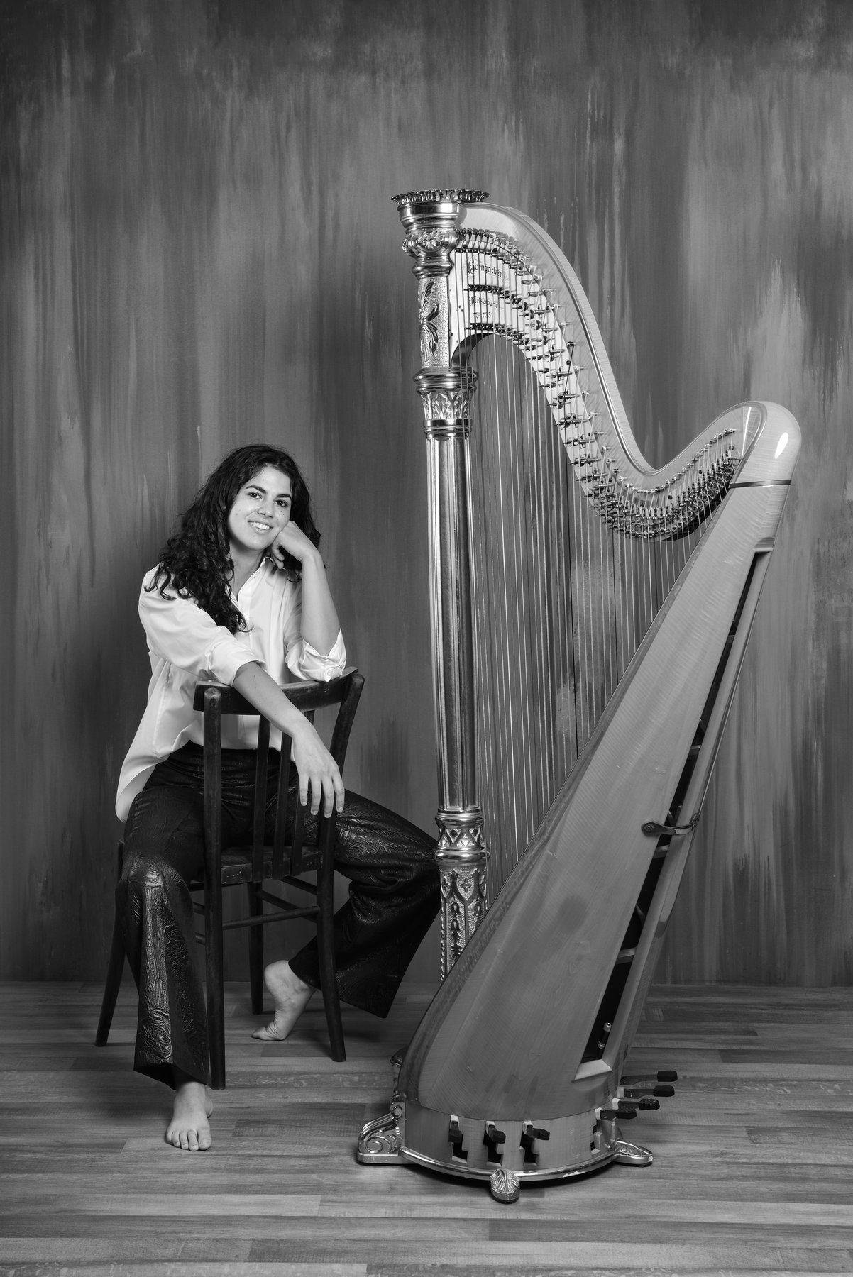 Black-and-white portrait of harpist Irene Pauletto
